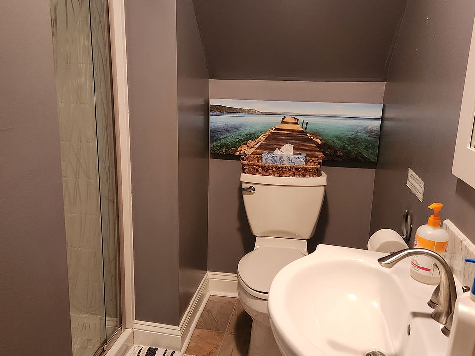 Bathroom with walk in shower. Includes a linen closet