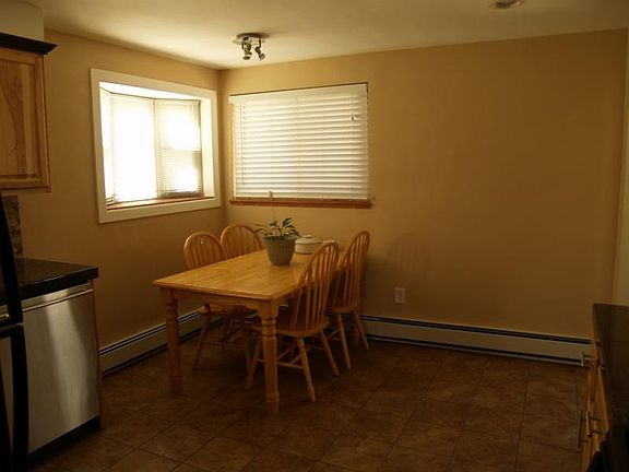 Kitchen seating area, window on the left is a bay window.