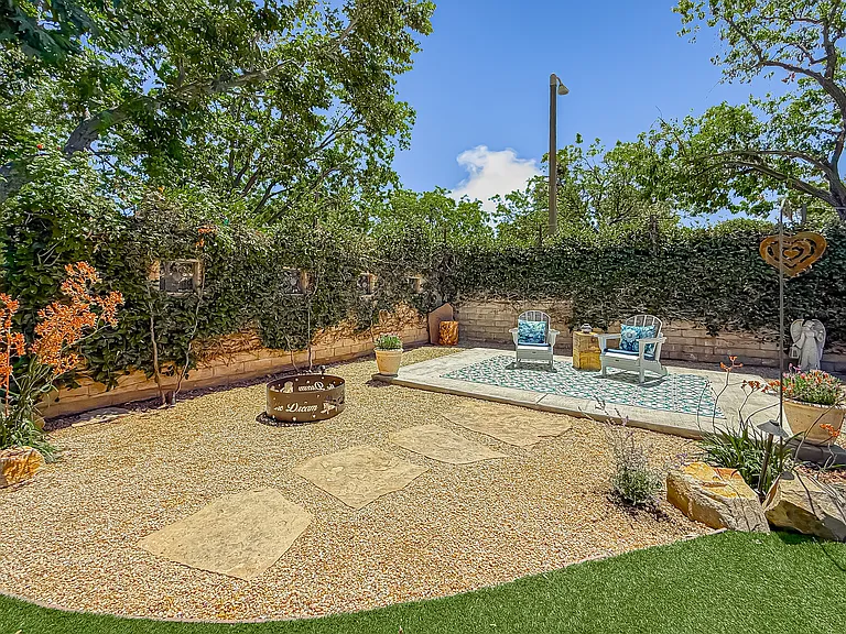 Backyard sun patio and Adirondack chairs with lake views