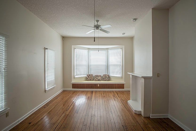 Living Room with Hardwood Floors, Bay Window