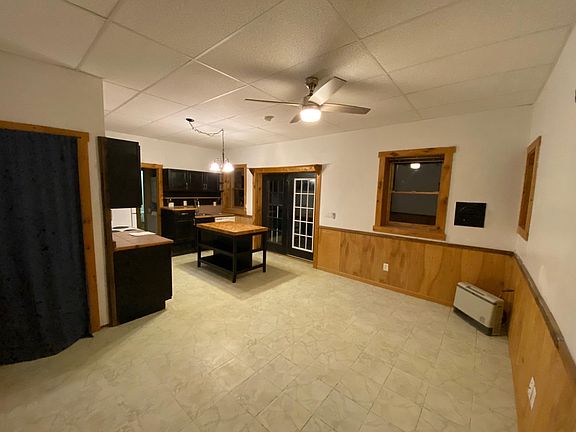 View of living room and kitchen island.
