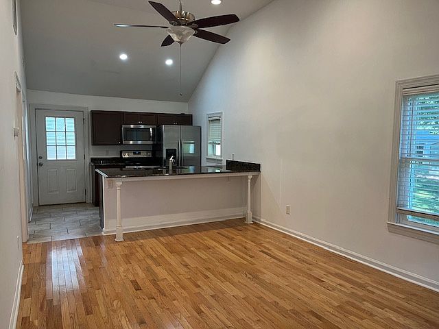 View from front entrance. Vaulted ceilings really make the Living Room space open up.