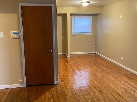 Living room...freshly re-done hardwood floors! Fresh Paint! New lighting throughout!