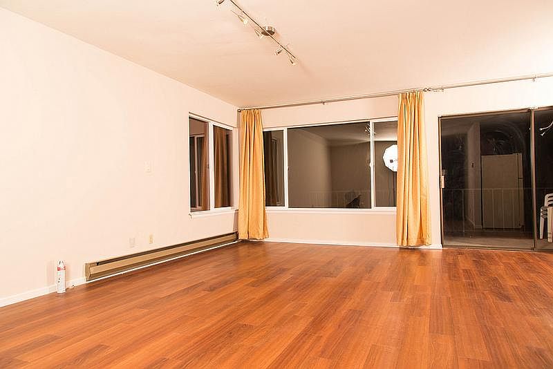 open floor plan living room facing back yard deck