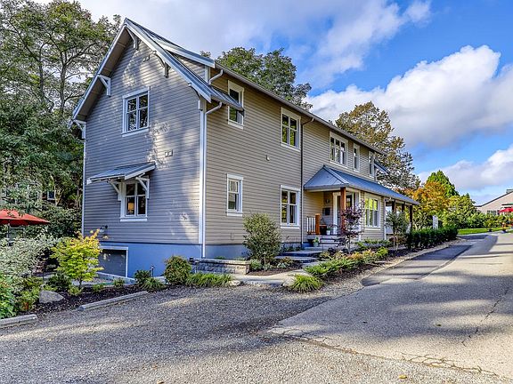 Thoughtfully designed 1,400 sq ft main floor unit is surrounded by gardens