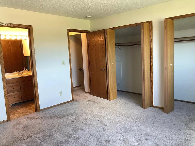 Primary bedroom with large closet and access to the main bathroom.