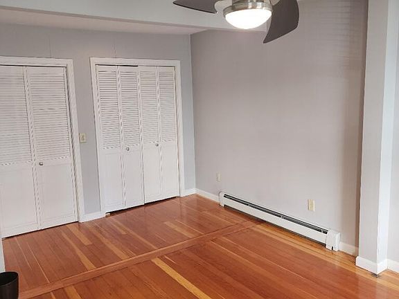 stackable washer/dryer unit behind sliding french door (on left) closet space (on right)