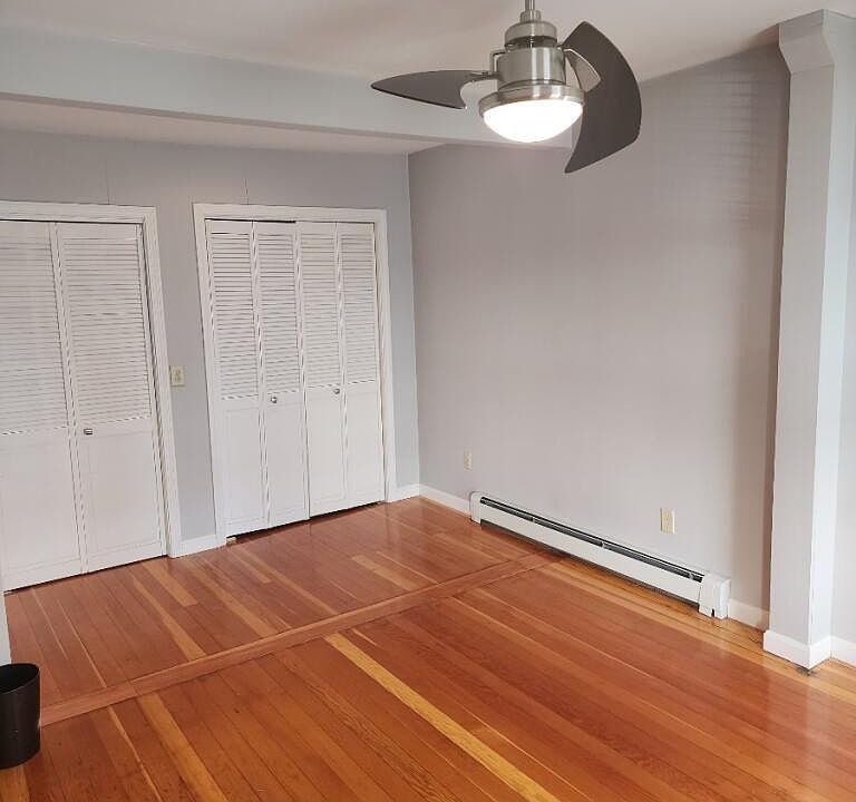 stackable washer/dryer unit behind sliding french door (on left) closet space (on right)