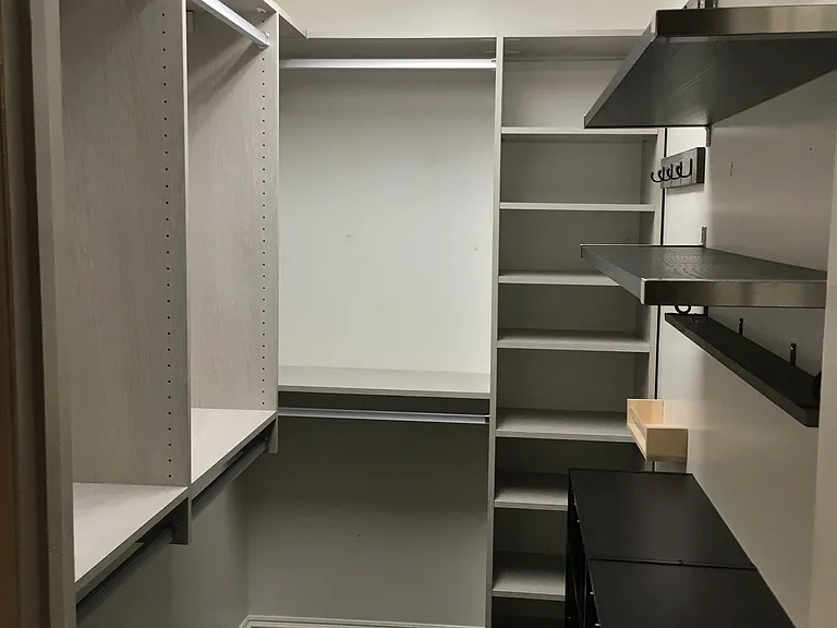 Primary bedroom walk in closet