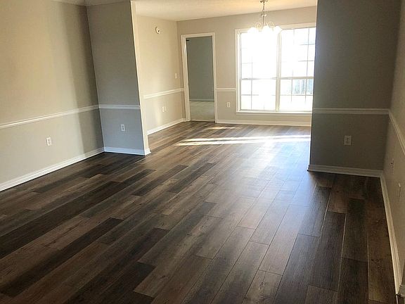 Living room looking into dining room/master bedroom