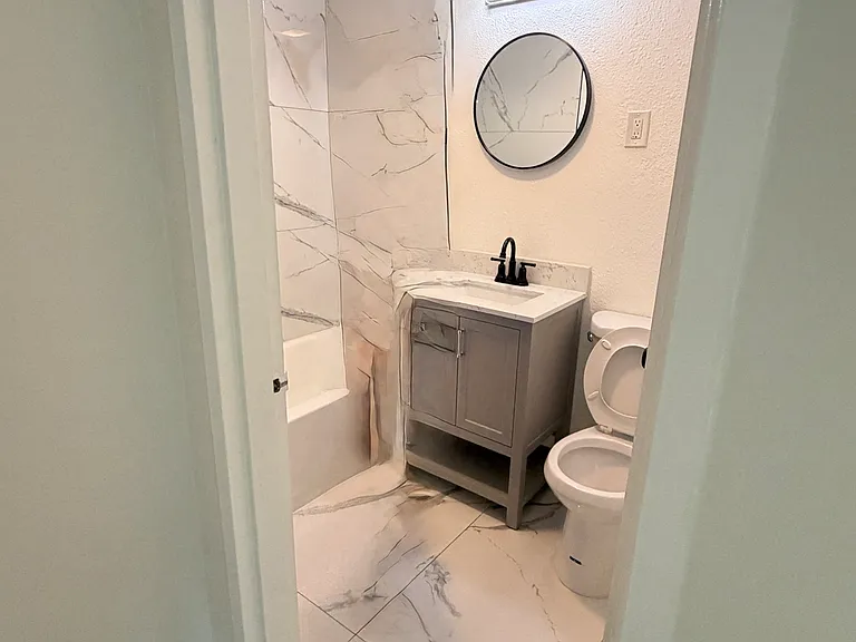 Remodeled bathroom, with shower and tub. Sink and toilet... beautiful space!!