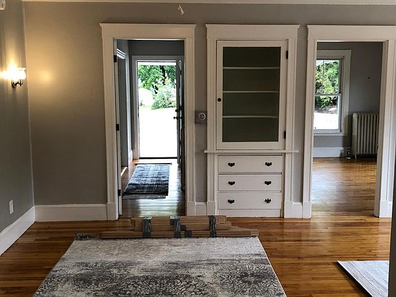 1 of 2 built in hutches. Hall has door separating room with non working fire place, no closet. Great for work at home. Bedroom on right.