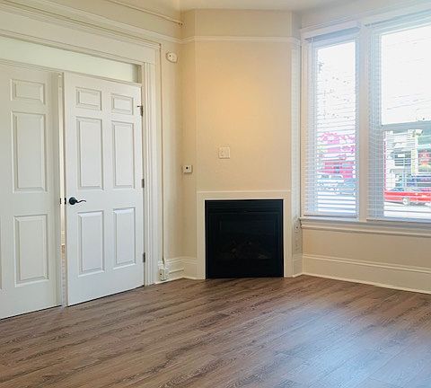 Living room with French doors leading to bedroom.