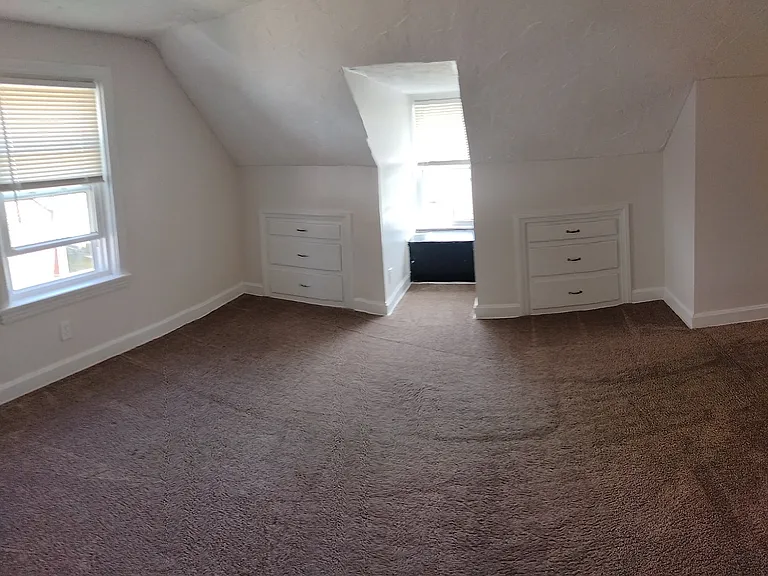 2nd floor bedroom #3 with closet, 2 windows and 2 built-in dresser drawers.