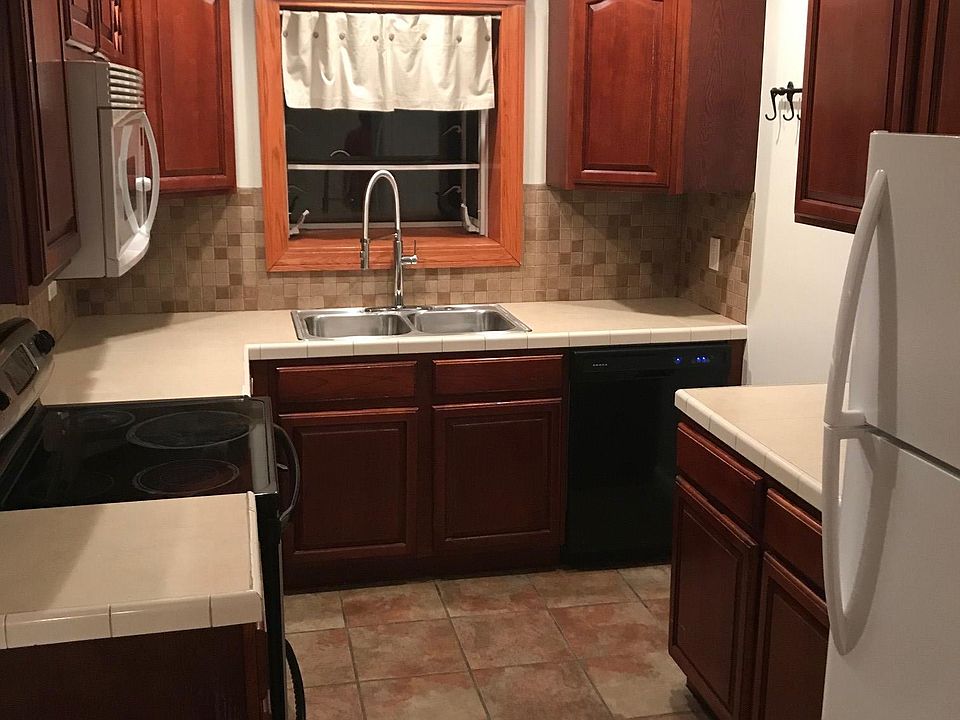 Kitchen includes microwave, oven, dishwasher & refrigerator. New kitchen faucet and shut-offs with garbage disposal