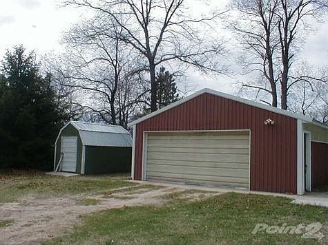 2 Stall garage and storage shed.