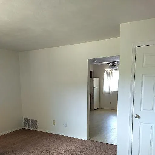 LARGE LIVING ROOM DOWNSTAIRS WITH COAT CLOSET
