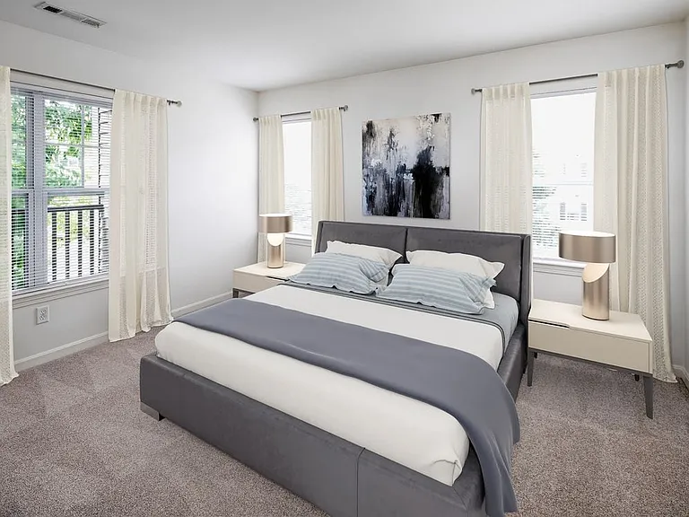 Phase I Renovated apartment bedroom with carpet