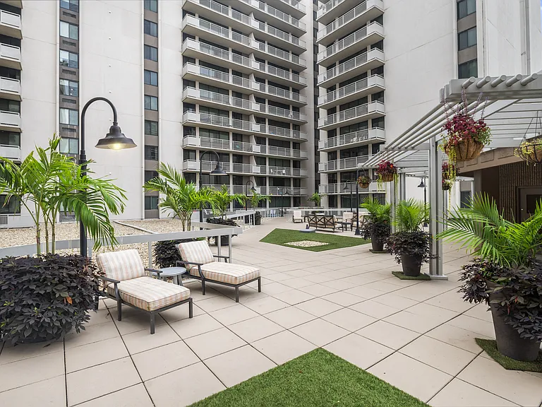 Beautifully Landscaped Courtyard with Seating and Sunning Areas