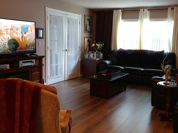 Living room. French doors open into Florida/Bar Entertainment Room.