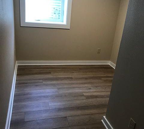 Basement bedroom #1. All new including insulation, electrical, egress windows, floors, walls, and paint.