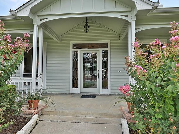 Enter through the beautiful leaded glass front door