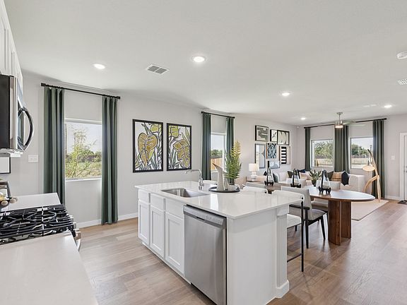 Kitchen in the Magnolia home plan by Trophy Signature Homes - REPRESENTATIVE PHOTO
