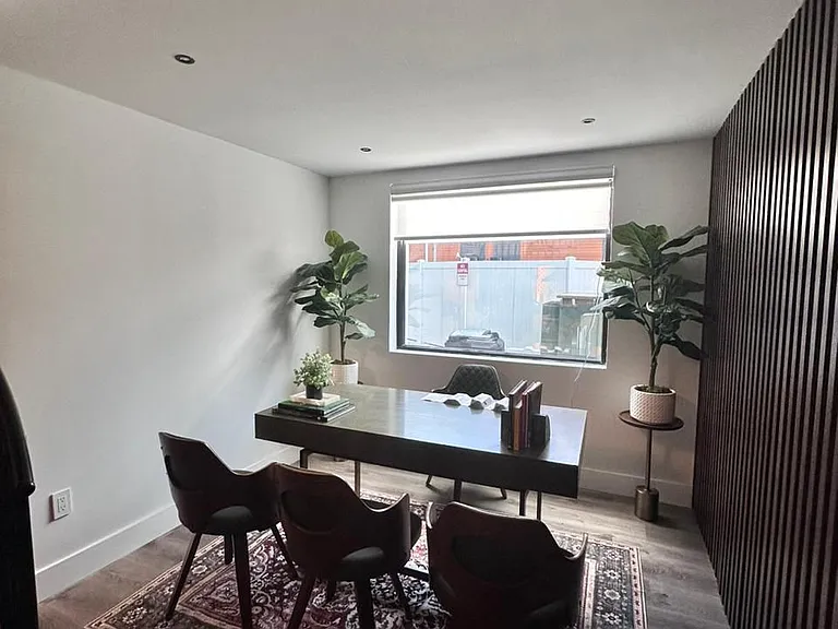 Refined workspace featuring modern seating and beautiful plants.