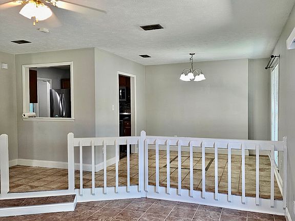 dinning room area taken from the living room. it also depicts kitchen area