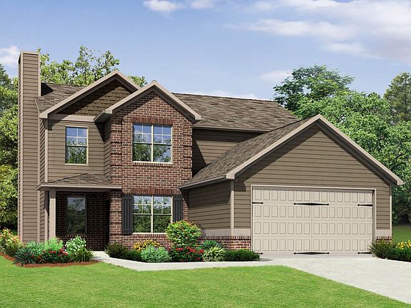 Front elevation with brick and garage