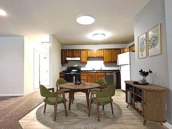 Open concept kitchen next to living room