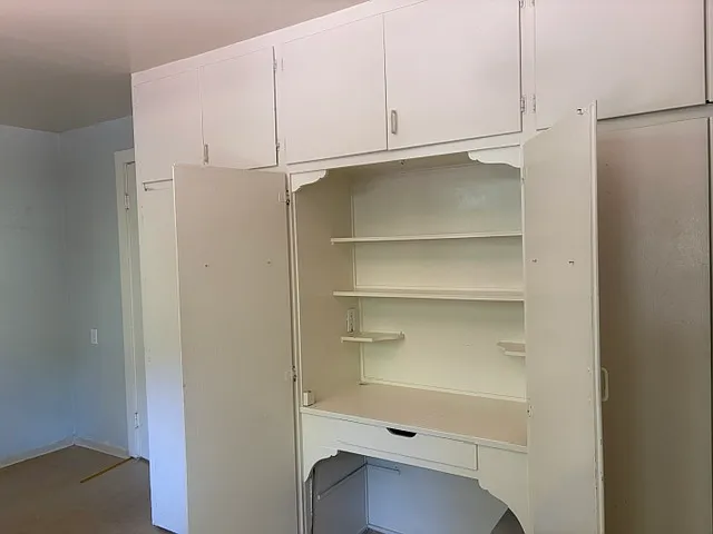 Laundry room with storage and desk off the kitchen