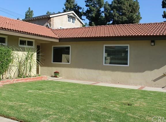 Welcome home! Large front yard with driveway and separate RV parking