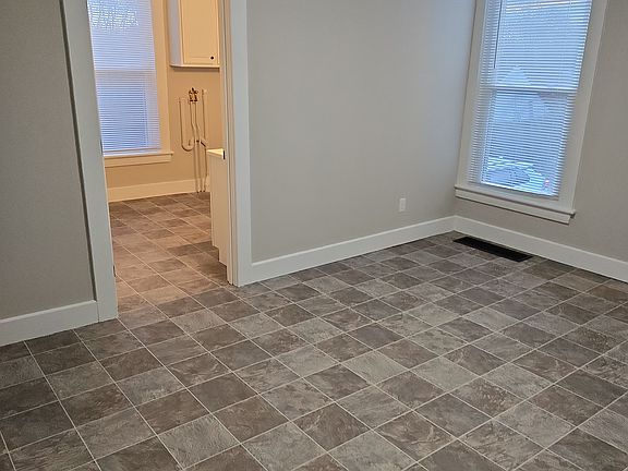 Kitchen looking into bathroom