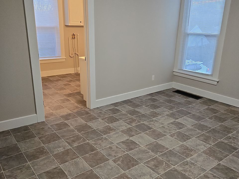 Kitchen looking into bathroom