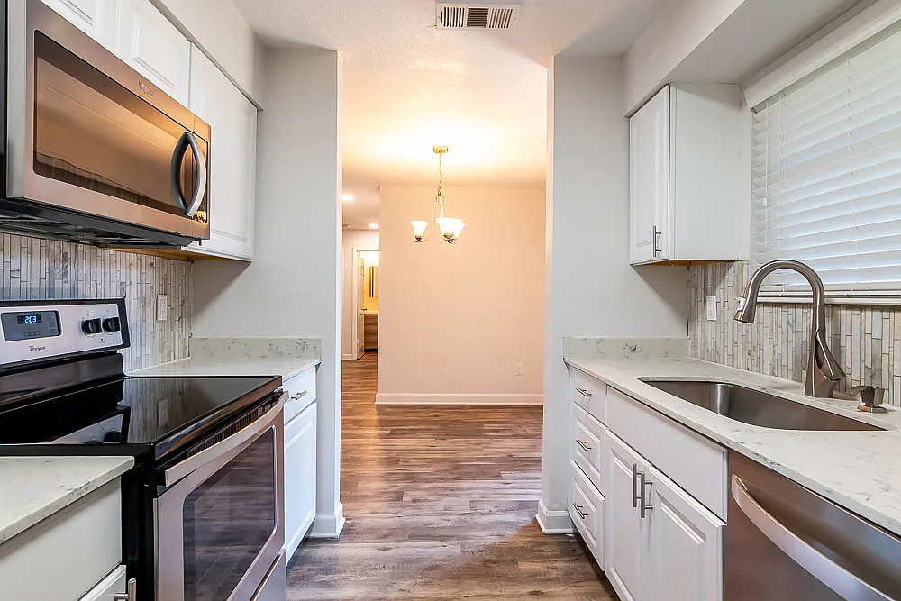 Kitchen view from one of our beautiful 2 bedroom 2 bathroom apartments! - Tramor at Hunter's Glen