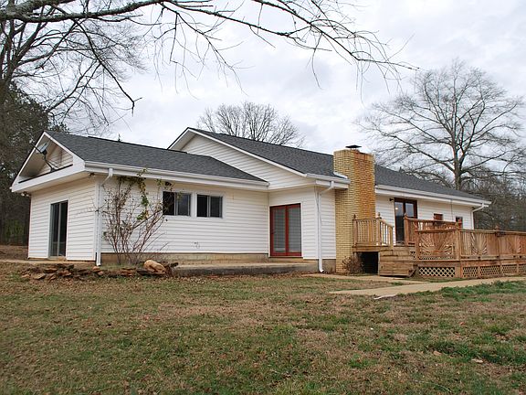 Back of home with deck