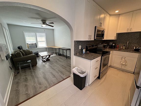 Full granite backsplash, easy to clean. Solid wood slow close cabinets. Stainless steel all around. Pull down faucet. Unit will be empty of furniture & professionally cleaned when you arrive to move in.