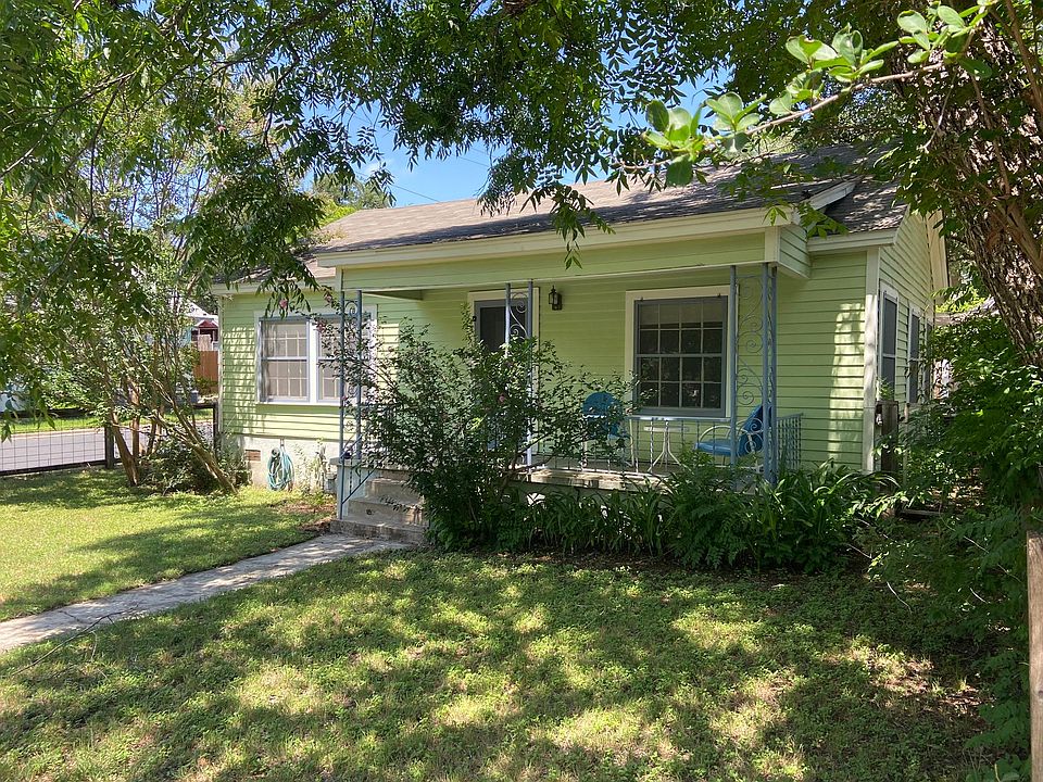 Shady front yard and covered porch.
