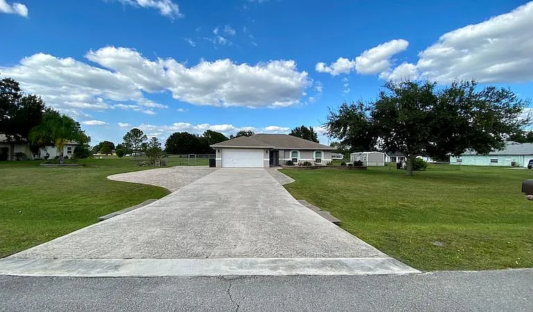 Front with plenty of parking spaces