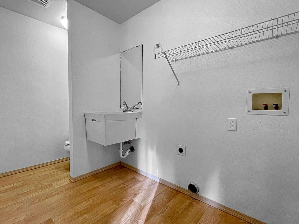 Utility room with washer and dryer hookups