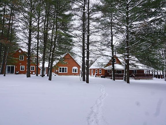Rear view of house on left & garage on right.