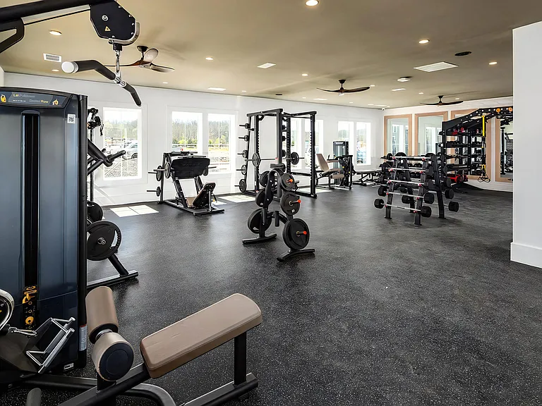 Spacious Fitness Center with Strength Machines, Free Weights, and Mirrors
