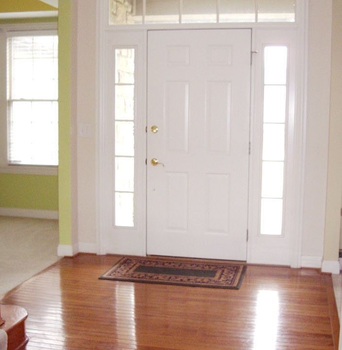 2 story Foyer with hardwood flooring