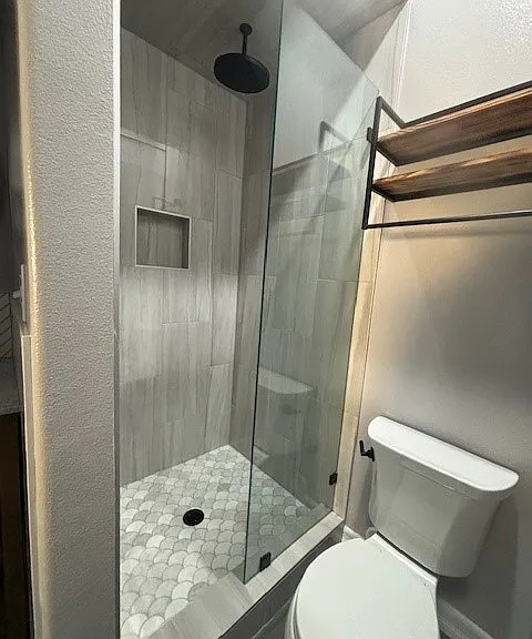 Rain shower head and custom tilework.