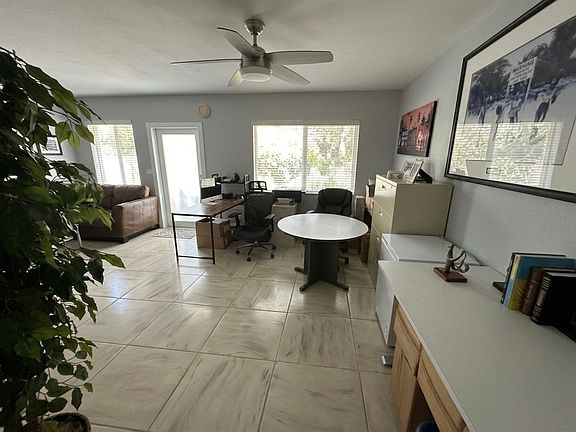 Same Living Area from Other Angle
The living space flows seamlessly _ room for a full dining set, living room, AND a home office all at once
