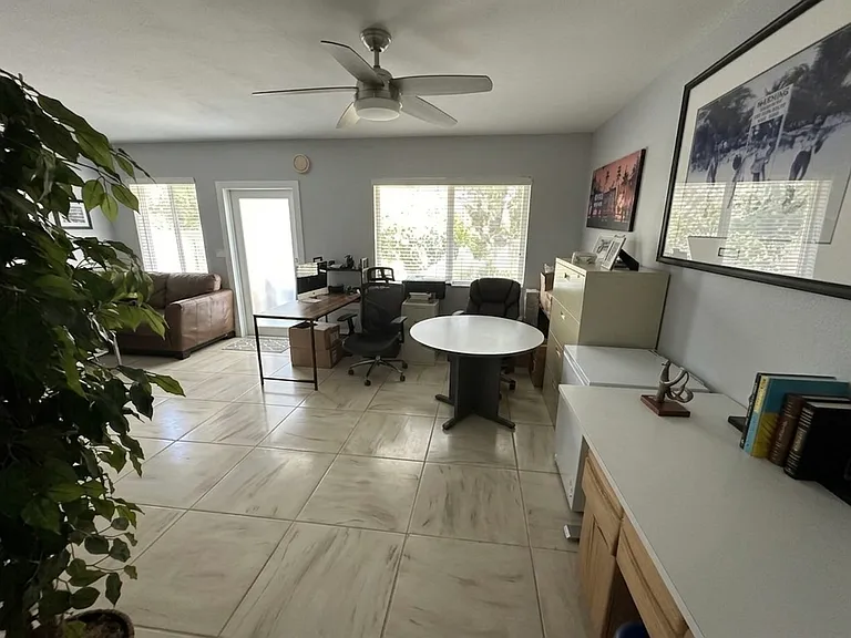 Same Living Area from Other Angle
The living space flows seamlessly _ room for a full dining set, living room, AND a home office all at once