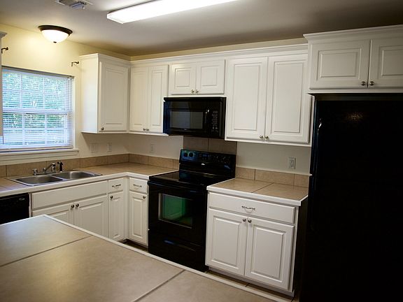 Kitchen (Includes Dishwasher, Glass top Stove, Microwave, Re