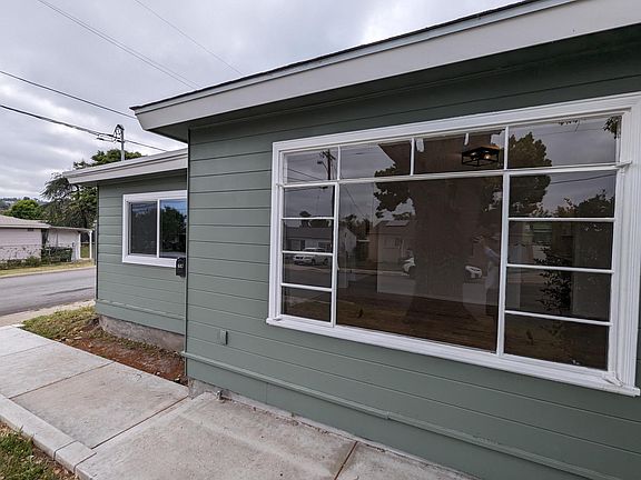 Close-up of large picture window and front walkway