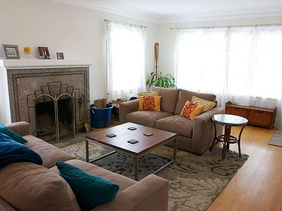Lots of windows and natural light in the living room.